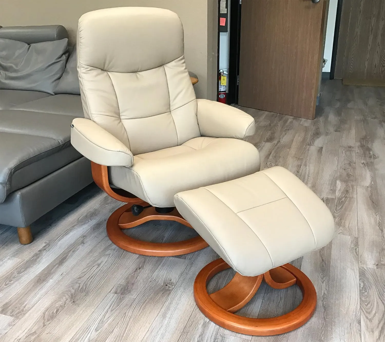 Large Leather Ergonomic Swivel Recliner Chair with Ottoman in Sandel NL 121 Nordic Line Leather with a Charcoal Wood Stain Base
