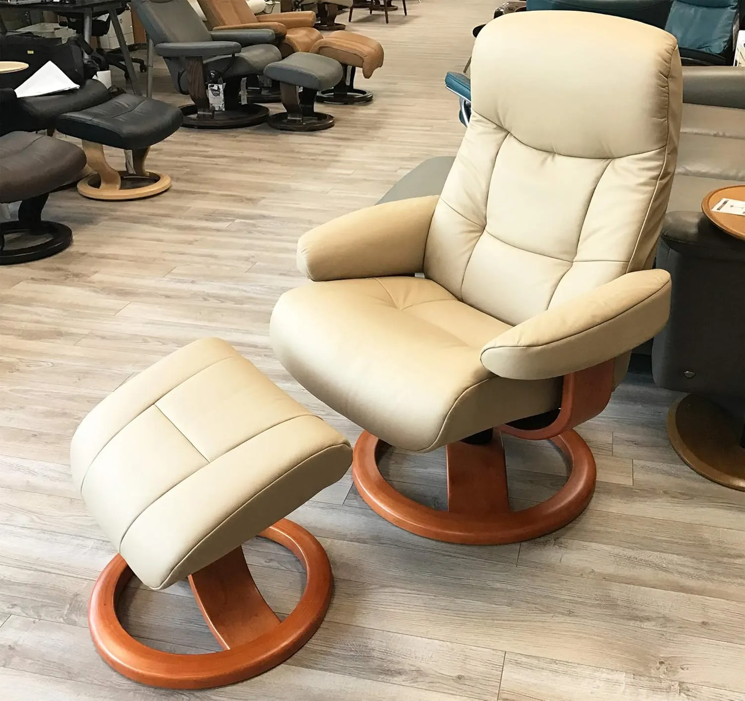 Large Leather Ergonomic Swivel Recliner Chair with Ottoman in Sandel NL 121 Nordic Line Leather with a Lite Oak Wood Stain Base