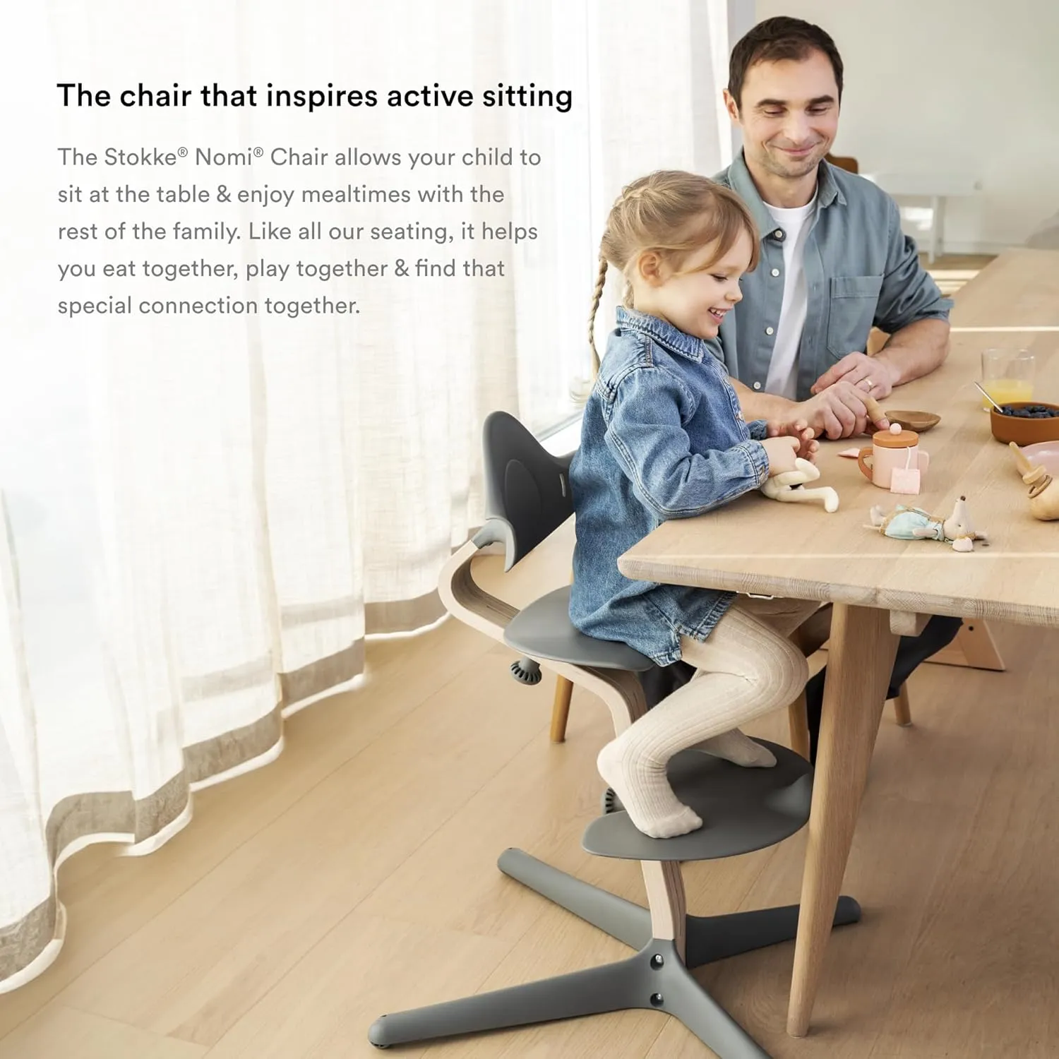 Stokke Nomi High Chair, Black/Walnut - Inspires Active Sitting - Tool-Free, Seamless Adjustability - Includes Baby Set with Removable Harness for Children 6-24 Months